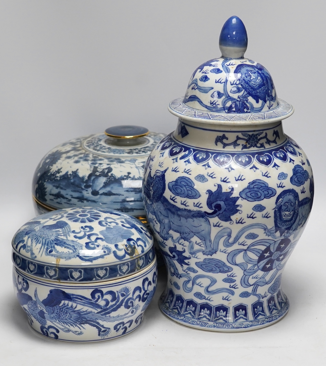 A 20th century Chinese blue and white vase and cover, a large bowl and cover and a smaller bowl and cover, tallest 44cm